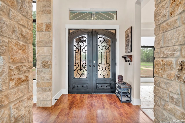 foyer featuring french doors and hardwood / wood-style flooring