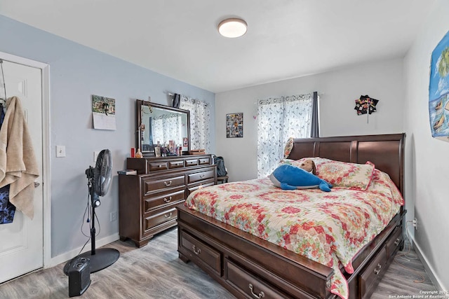 bedroom with light hardwood / wood-style flooring