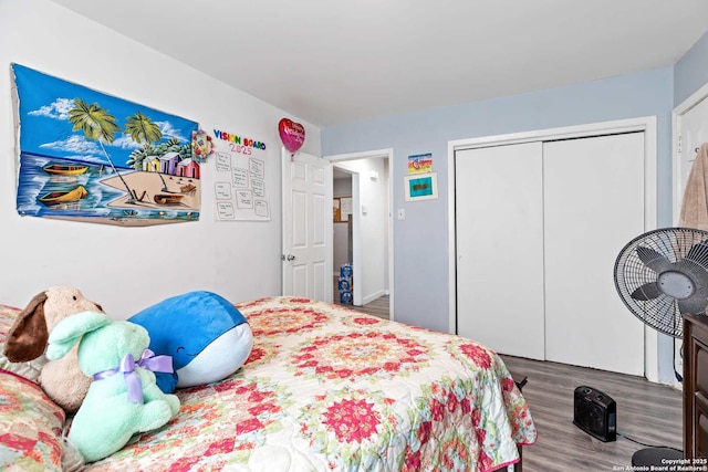 bedroom featuring hardwood / wood-style flooring and a closet