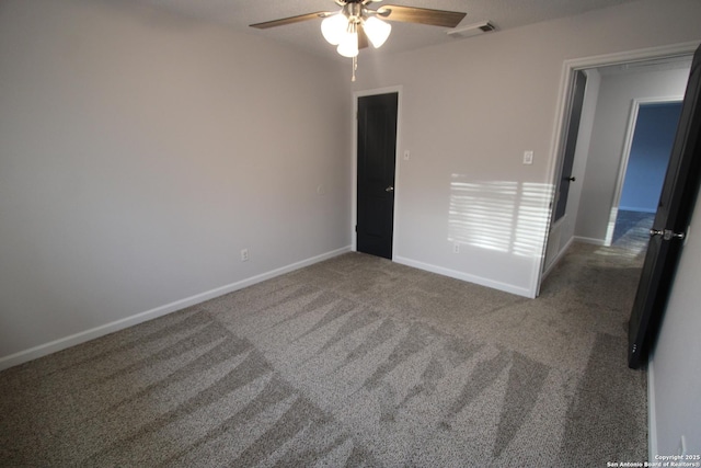 carpeted empty room with ceiling fan