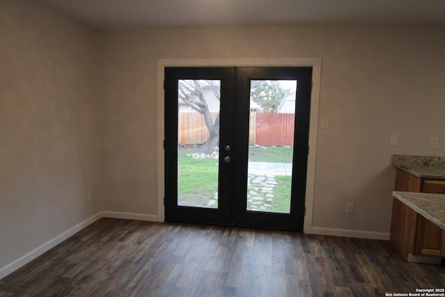 doorway to outside featuring dark wood-type flooring and french doors