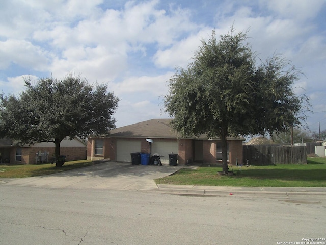 view of front of house with a garage and a front yard