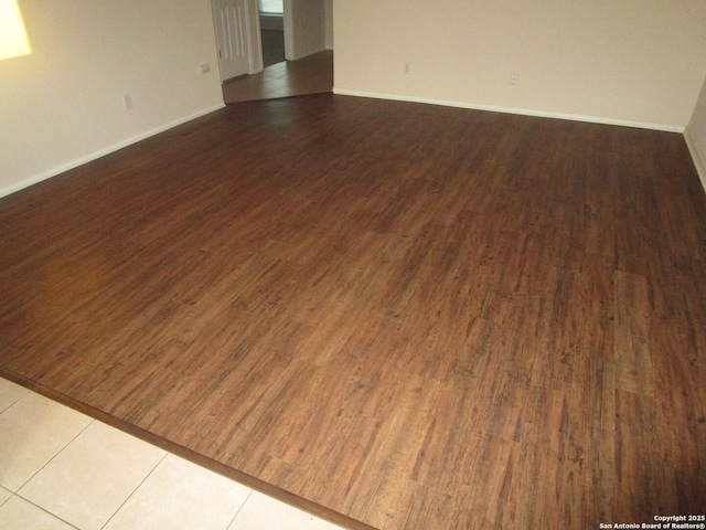 empty room featuring wood-type flooring