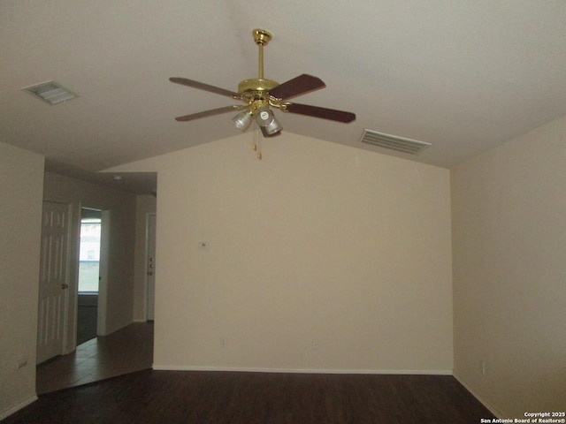 spare room featuring ceiling fan, lofted ceiling, and dark hardwood / wood-style flooring