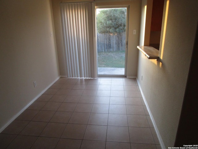 spare room with light tile patterned floors