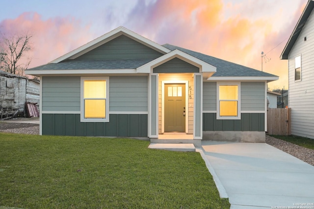 view of front of home with a yard