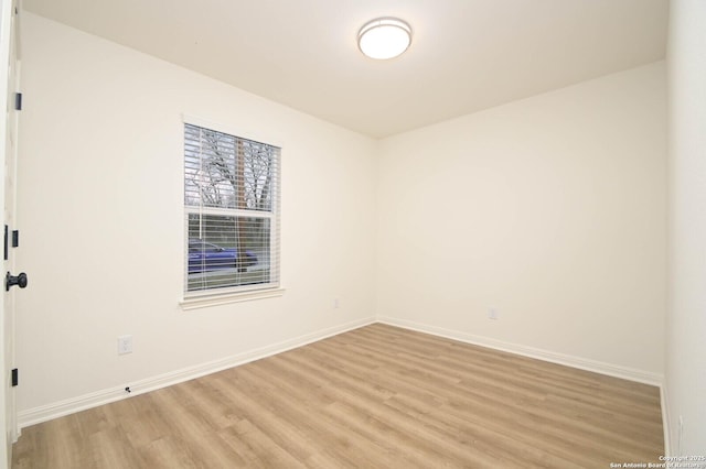 spare room with light hardwood / wood-style floors