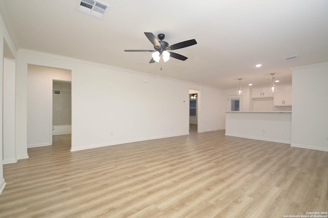 unfurnished living room featuring ceiling fan, ornamental molding, and light wood-type flooring