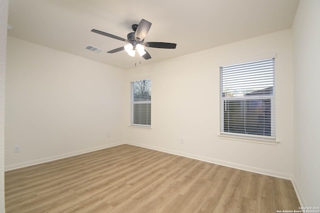 spare room with ceiling fan and light hardwood / wood-style floors