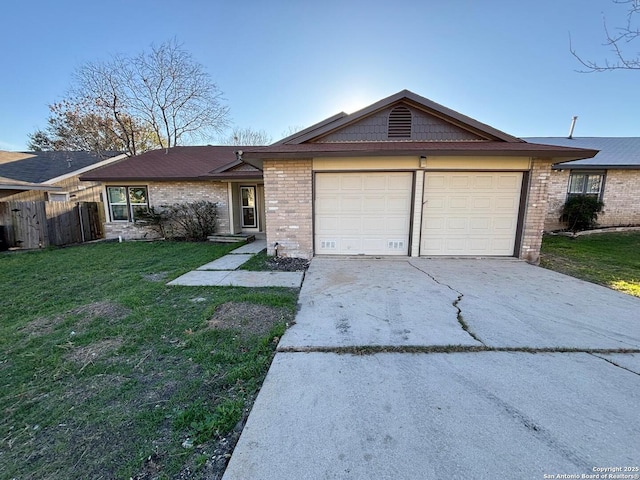 ranch-style home with a garage and a front yard