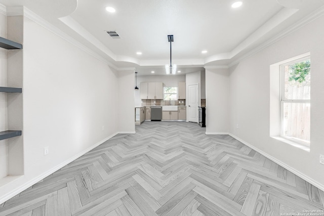 unfurnished living room featuring a raised ceiling and light parquet floors