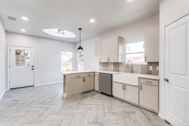 kitchen featuring kitchen peninsula, decorative light fixtures, sink, dishwasher, and decorative backsplash