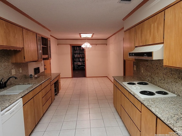 kitchen featuring sink, crown molding, white appliances, light tile patterned flooring, and decorative backsplash