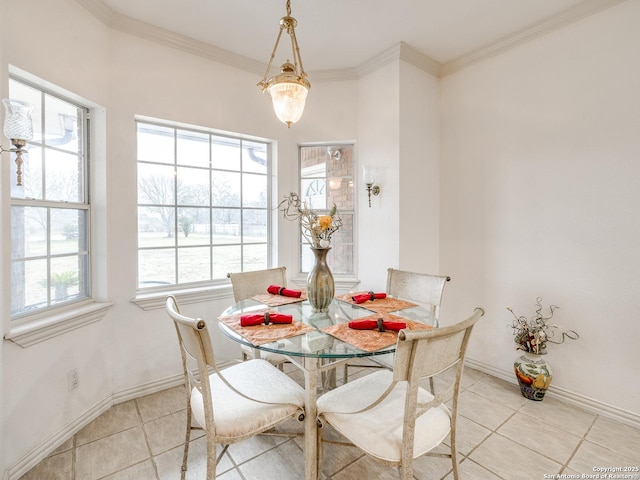 dining room featuring ornamental molding and light tile patterned floors