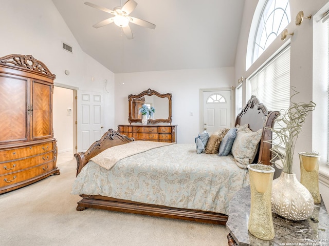 bedroom featuring high vaulted ceiling, light colored carpet, and ceiling fan