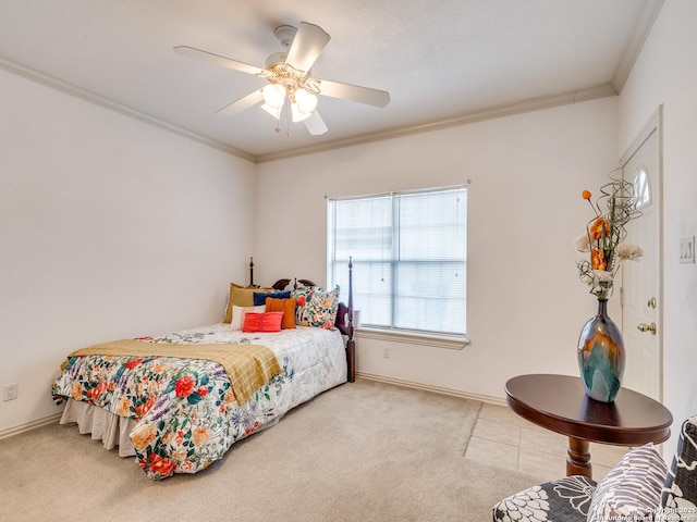 carpeted bedroom with crown molding and ceiling fan