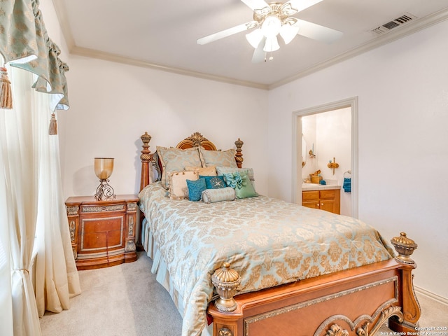 carpeted bedroom featuring ornamental molding, ceiling fan, and ensuite bathroom