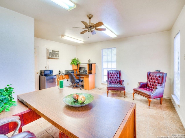 office with ceiling fan and a wall unit AC