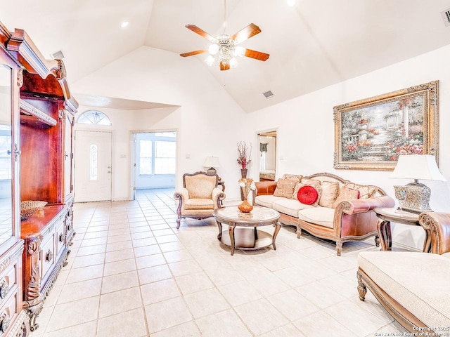 living room featuring light tile patterned floors, high vaulted ceiling, and ceiling fan