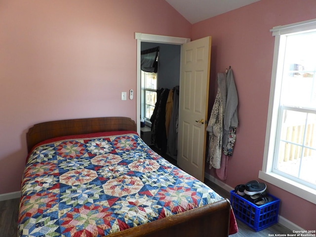 bedroom featuring vaulted ceiling