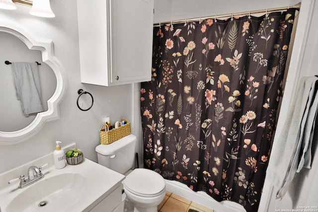 bathroom with vanity, curtained shower, tile patterned floors, and toilet