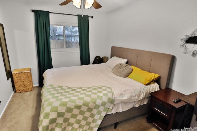 bedroom with light carpet and ceiling fan