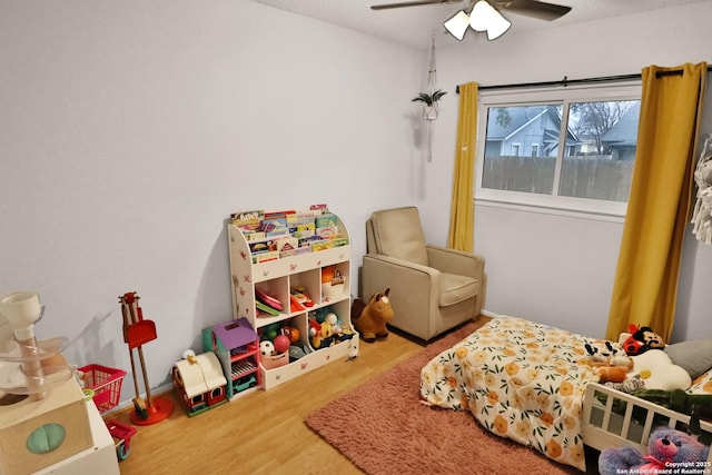 bedroom featuring hardwood / wood-style floors and ceiling fan