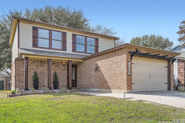 view of front property featuring a garage and a front yard