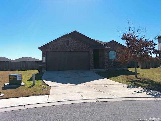 single story home featuring a garage and a front lawn