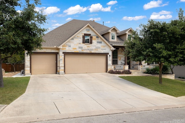 craftsman-style home with a garage and a front lawn