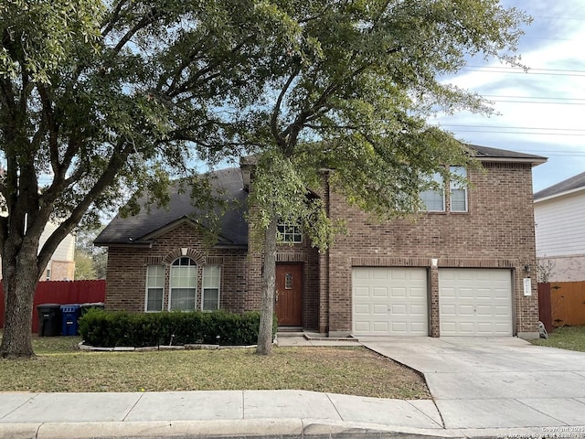 view of front of property featuring a garage and a front yard