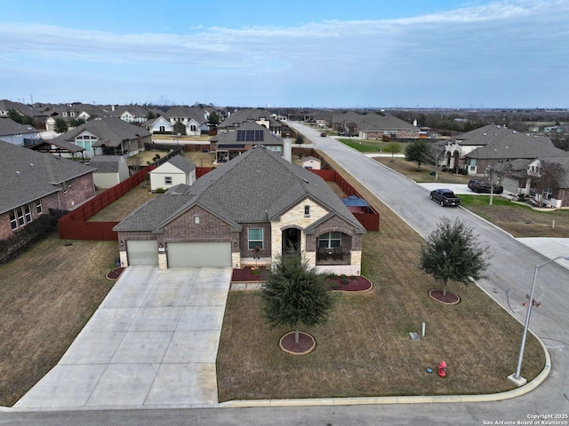 view of front of home with a garage and a front yard