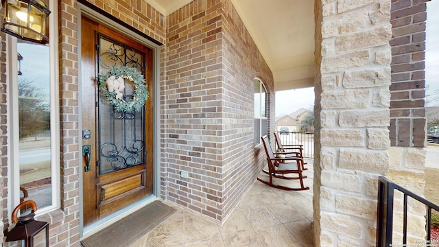 property entrance with covered porch