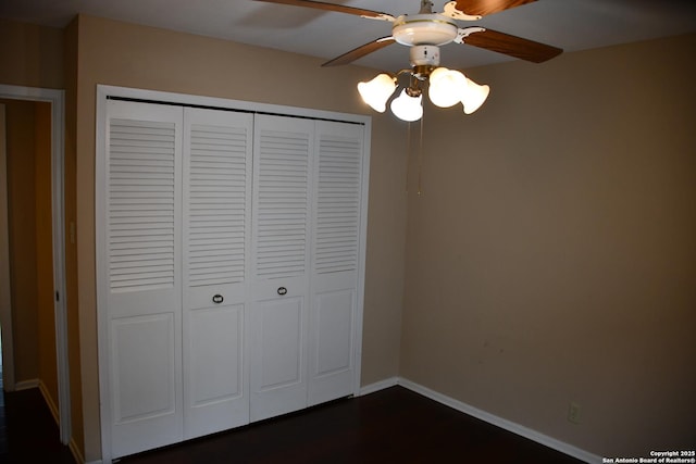 unfurnished bedroom with a closet and ceiling fan