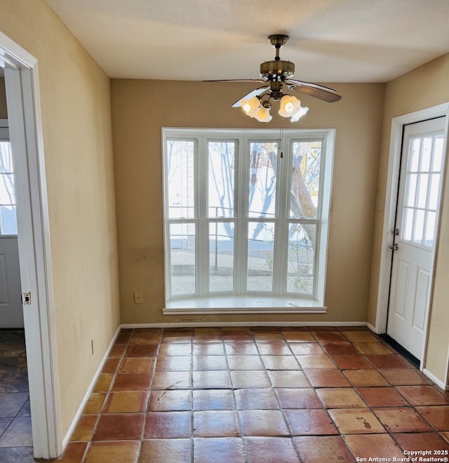 entryway with ceiling fan