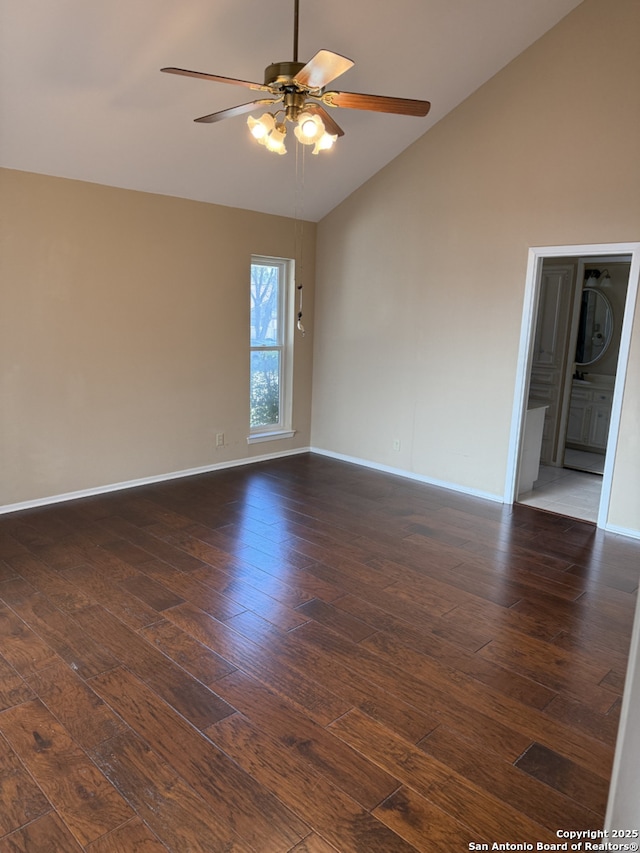 empty room featuring ceiling fan, high vaulted ceiling, and dark hardwood / wood-style floors