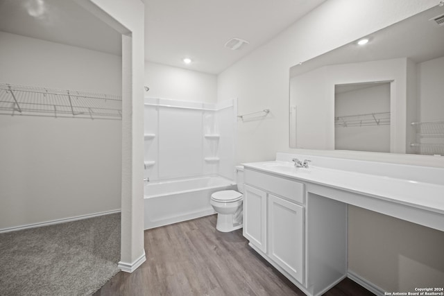 full bathroom with vanity, bathing tub / shower combination, toilet, and hardwood / wood-style floors