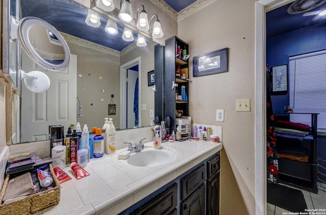 bathroom with vanity and crown molding