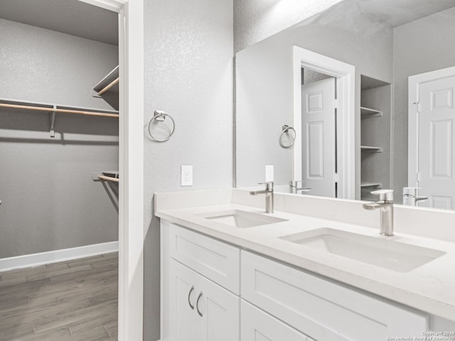 bathroom with vanity and hardwood / wood-style floors