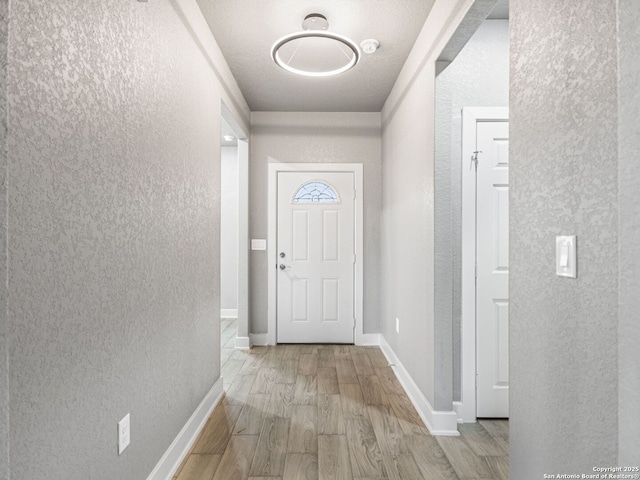 doorway with light wood-type flooring