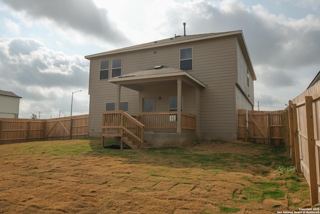 8409 Roadrunner Psge, San Antonio, TX 78222 - rear view of property featuring a fenced backyard and stairway