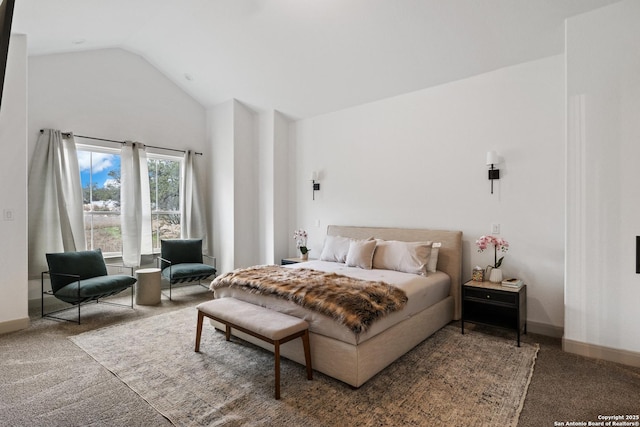 bedroom with carpet and vaulted ceiling