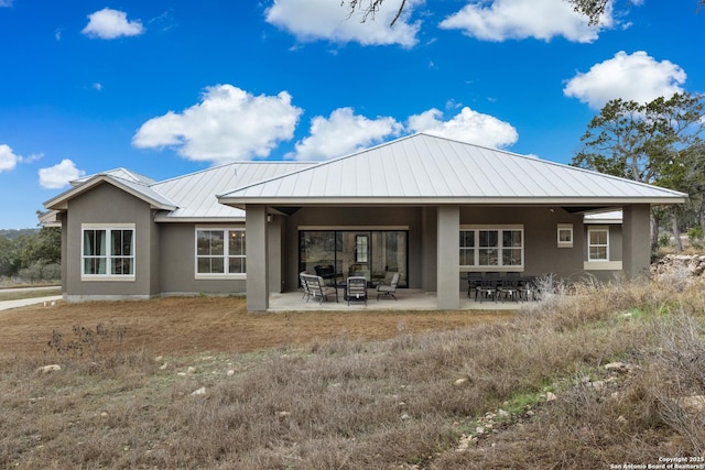 rear view of house featuring a patio area