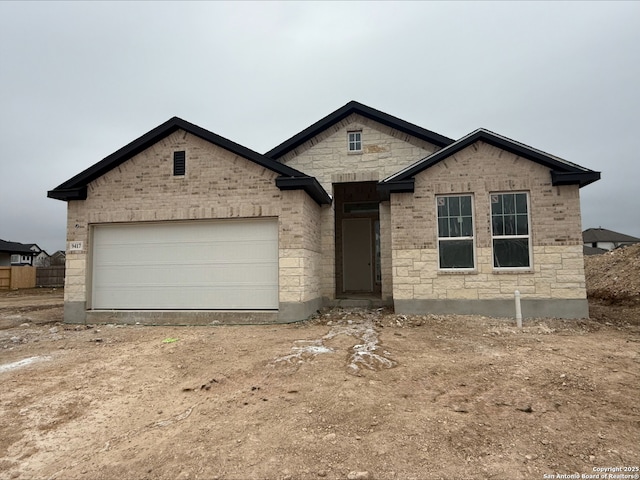 property in mid-construction featuring a garage