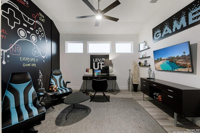 office space featuring ceiling fan and light hardwood / wood-style floors