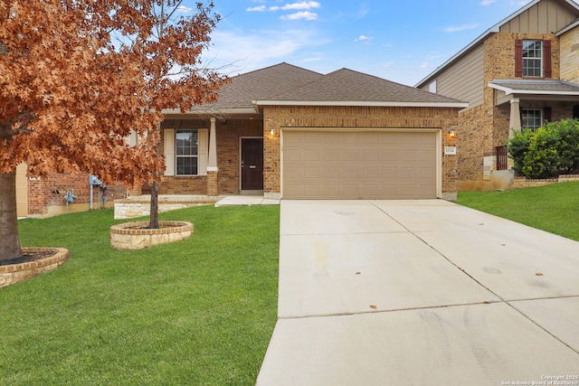 view of front of home with a garage and a front yard