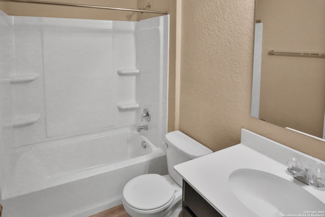 full bathroom featuring bathtub / shower combination, vanity, and toilet