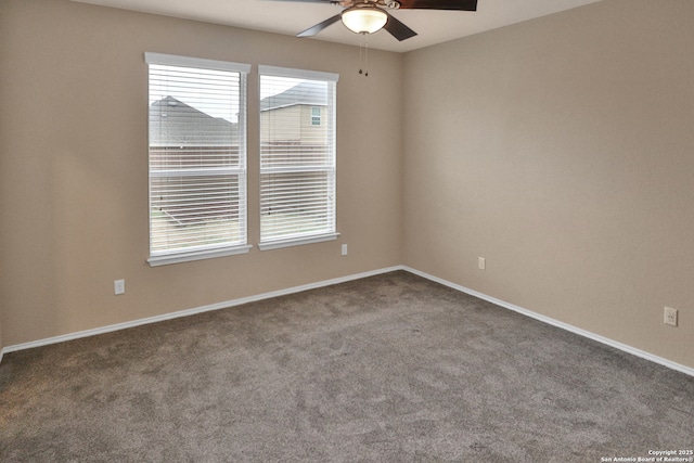 empty room featuring ceiling fan and carpet flooring