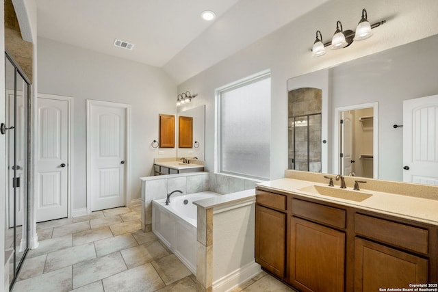 full bath featuring lofted ceiling, vanity, visible vents, a bath, and a stall shower