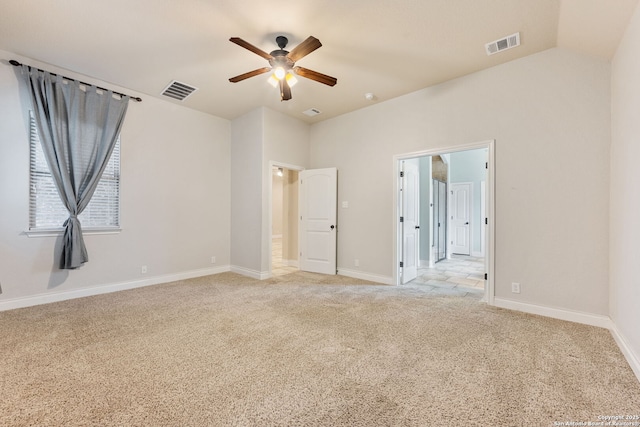 unfurnished bedroom with light carpet, a ceiling fan, visible vents, and baseboards